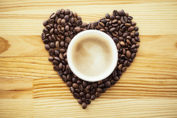 Good Morning. Coffee Time. Coffee to go and beans on a wooden background