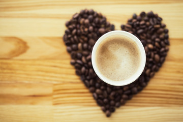 Good Morning. Coffee Time. Coffee to go and beans on a wooden background