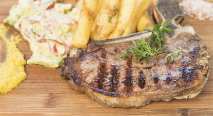 T-Bonne Steak With Salad, Fries, Mustard.