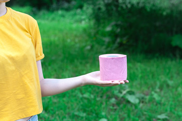 Female Hold toilet paper outdur nature. Concept of diarrhea in summer season