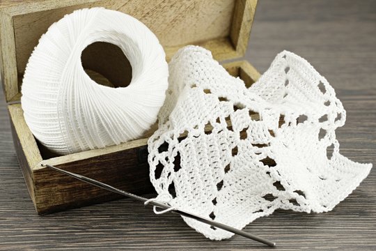 Make your crochet doily yourself with white yarn