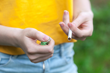 Fototapeta premium Female hand holding cigarette