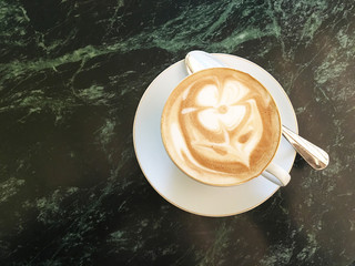 Attractive cappuccino with a drawing of flower