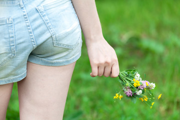 Woman holding wild flowers
