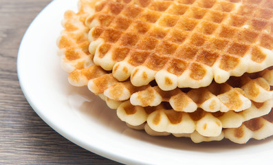 Waffles on a white plate.