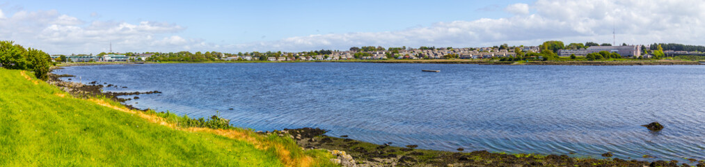 Fototapeta na wymiar Lough Atalia bay with houses in background