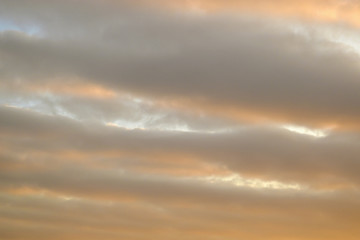 Orange, wavy clouds in the sky.