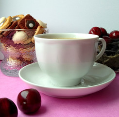 coffee berry cookies. having a snack. dessert. coffee with milk. pink background.