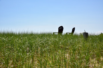 empty chairs in summer on New England coast vacation