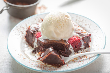 Raspberry chocolate brownies with vanilla ice creams 