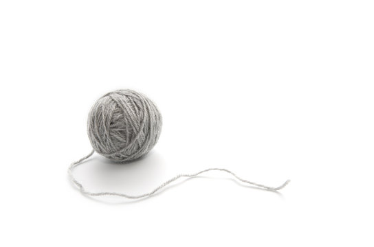 Ball of yarn on white background