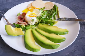 Poached egg with corn vegetables, grilled pepper, spinach, arugula, green beans and baby salad. Natural food. Scandinavian Breakfast