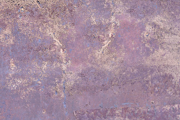 Metal painted violet wall texture with exfoliating paint.