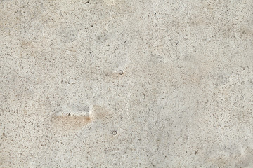 Texture of an old dilapidated concrete wall, light grey color.
