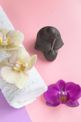 Beautiful soap in the form of flowers and towel with lavender flowers for Spa treatments on a two-tone background. Selective focus