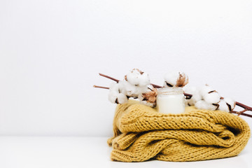 Cotton with warm sweater. Hipster minimal background. Still life creative composition