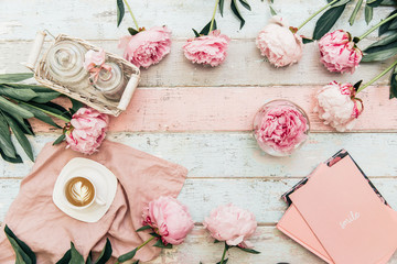 Flat lay trendy background . Coffee with notebook, and peony flower