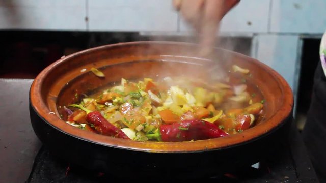 Chef Cooking a Traditional Moroccan Tajine