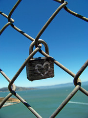 Love Lock Against Bay Landscape