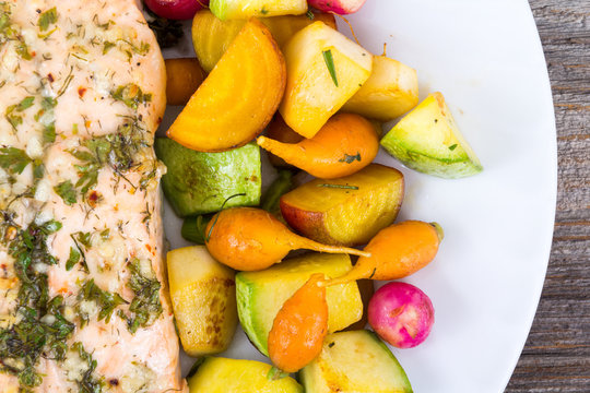 garlic herb salmon with small vegetables