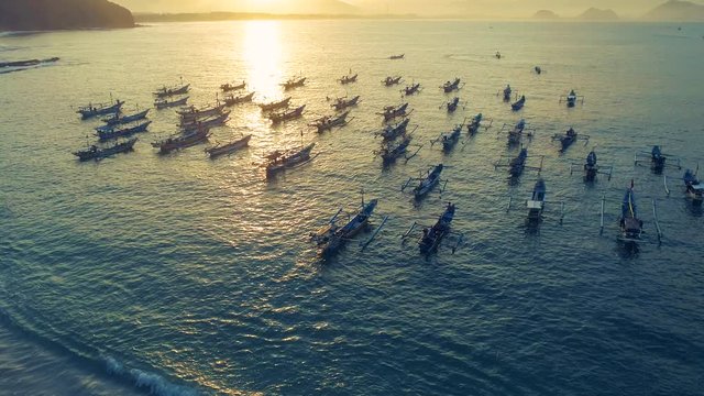 Indonesia traditional fishing boats docked in shores after fishing an aerial view, Papuma beach Jember
