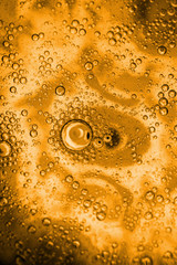 beer goldish oil textures and sparkles macro