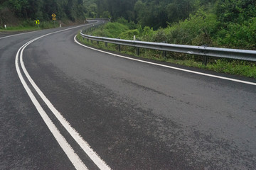 Winding road through scenic green mountains