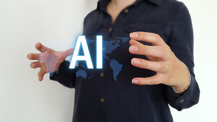 Businesswoman using artificial intelligence hologram over a world map