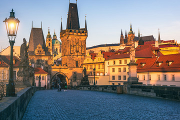 Fototapeta na wymiar Morning view of Charles Bridge in Prague, Czech Republic. The Charles Bridge is one of the most visited sights in Prague. Architecture and landmark of Prague