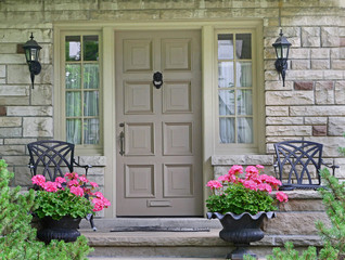 Fototapeta na wymiar front door of house with flower pot.