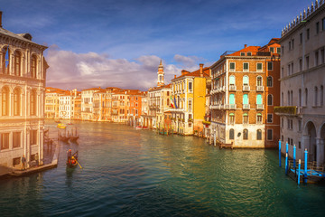 Grand Canal with gondolas in Venice, Italy. Sunset view of Venice Grand Canal. Architecture and landmarks of Venice. Venice postcard