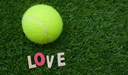 LOVE for tennis word are on green grass 