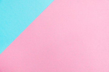 Pastel colored paper flat lay top view, background texture, pink and blue.
