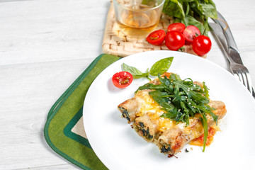 Cannelloni with spinach, cheese and bechamel sauce.