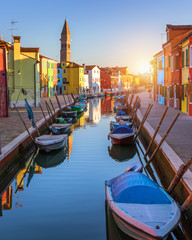 Beautiful view of the canals of Burano with boats and beautiful, colorful buildings. Burano village...