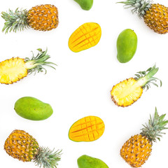 Food background of pineapple and mango fruits on white background. Flat lay, top view. Tropical concept.