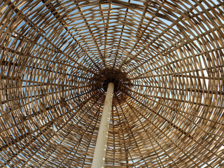 Straw umbrella and the sky at the beach