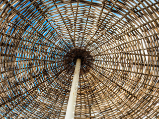 Straw umbrella and the sky at the beach