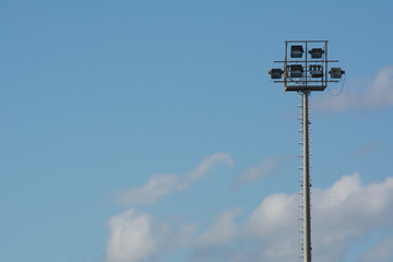 Horizontal View of Stadium Illunimators on Blue Sky Background