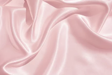 Fotobehang Stof De textuur van de satijnen stof van roze kleur voor de achtergrond