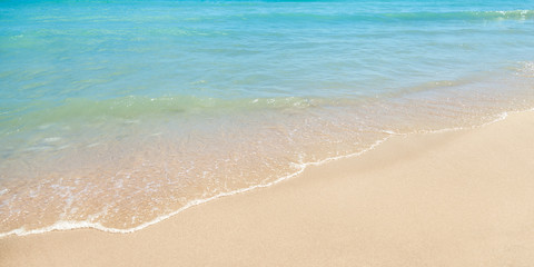 Fototapeta na wymiar Sand and Water With Waves