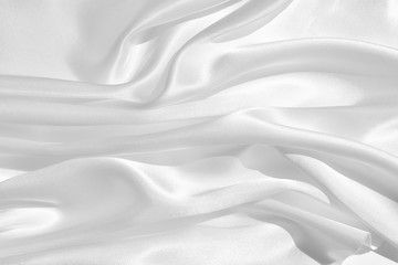 Fototapeta premium The texture of the satin fabric of white color for the background 