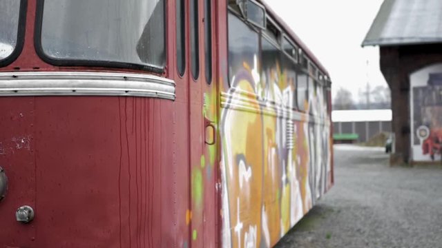 An old train painted with graffiti.