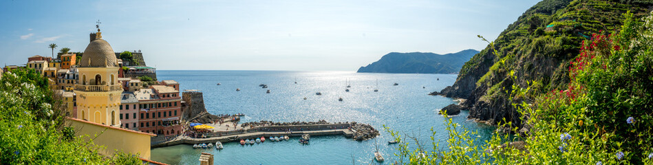 Panoramic View of the Bay in front of the Town of Vernazza on Blue Sky Background. - obrazy, fototapety, plakaty