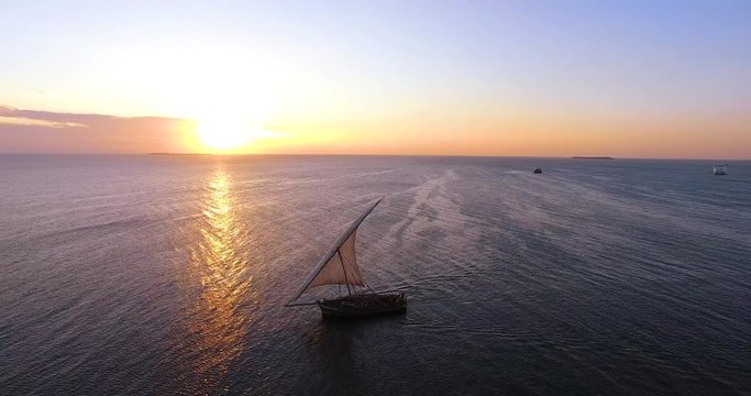Aerial clip of a Dhow boat in Zanzibar, Tanzania, during sunset.