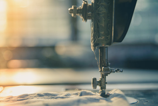 Closeup the sewing machine and item of clothing, old sewing machine,vintage style