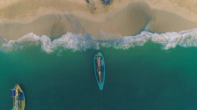 Indonesia traditional fishing boats docked in shores after fishing an aerial view, Papuma beach Jember