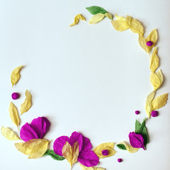 Floral frame of tissue paper on white background.