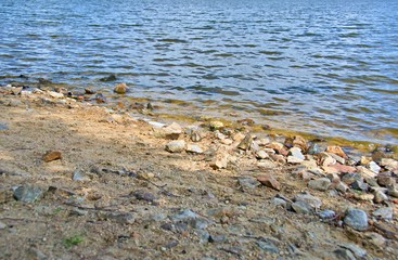 sandy beach with stones