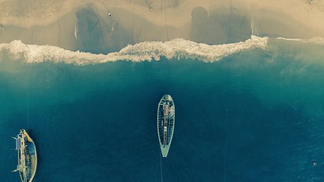 Indonesia traditional fishing boats docked in shores after fishing an aerial view, Papuma beach Jember